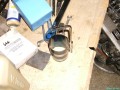 Das Kolbenringspannband, um die Kolbenringe auf ihre richtige Größe zu pressen, damit man den Kolben wieder in den Zylinder einlassen kann.